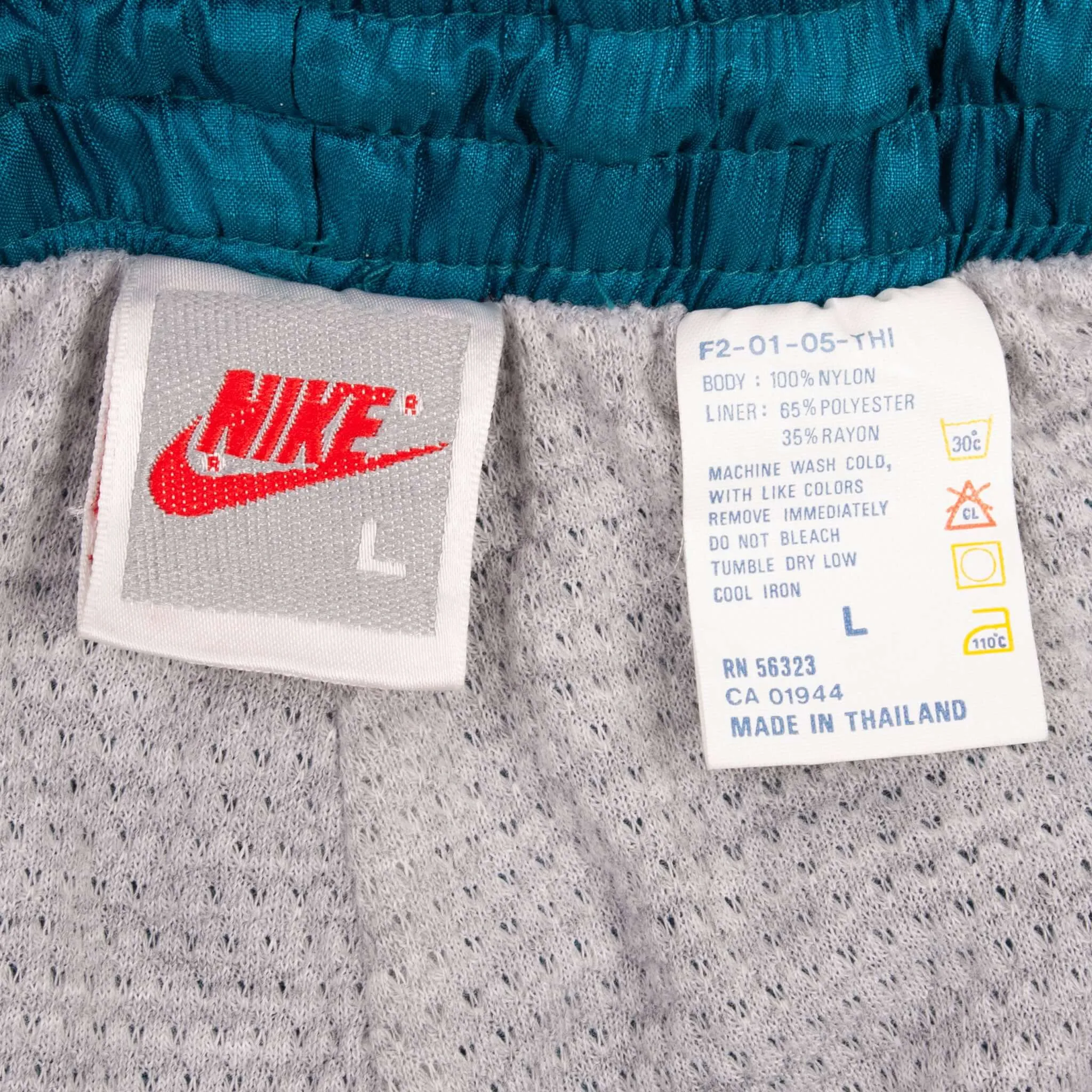 VINTAGE NIKE CLASSIC SWOOSH TURQUOISE BLUE NYLON TRACK PANTS EARLY 1990S SIZE LARGE